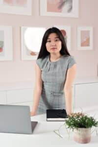 a pretty woman in a grey dress